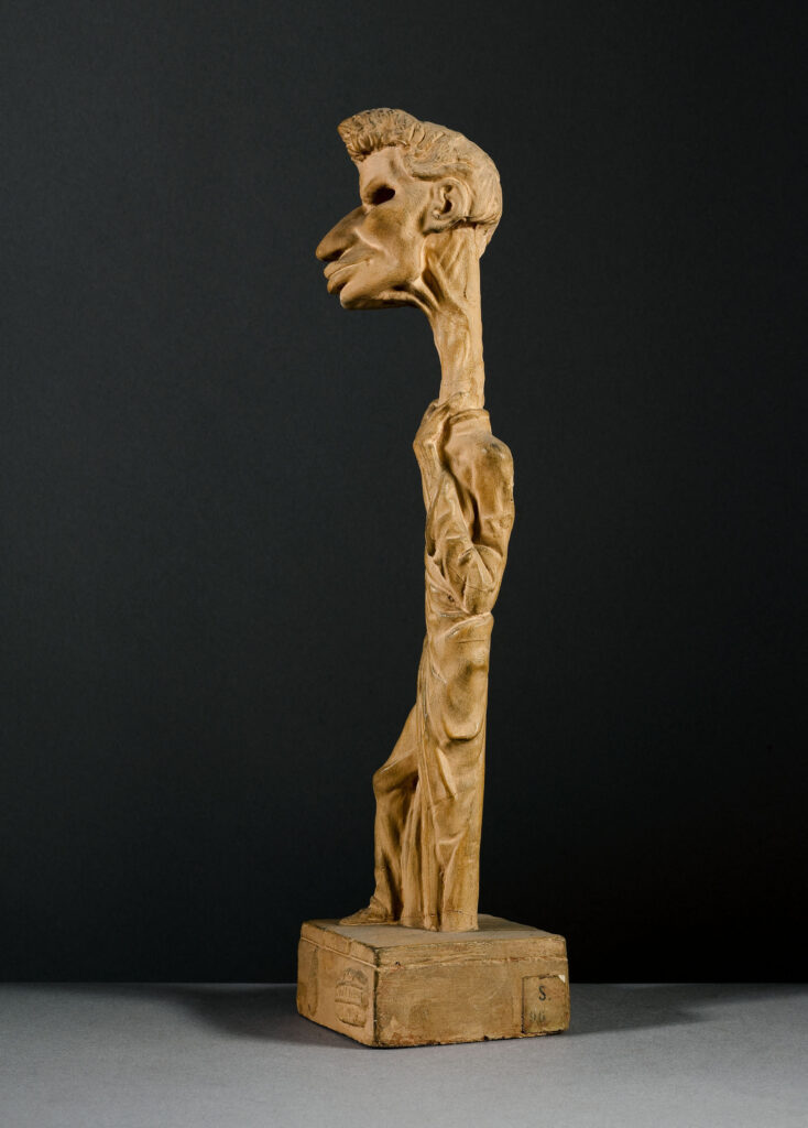 Dantan jeune, Portrait-charge d'Adrien Perlet (1795-1850), acteur, Statuette en plâtre patiné terre cuite, sur une base de section carrée ; dimensions : H. 34.5 × L. 8 × P. 8 cm ; Musée Carnavalet, Histoire de Paris, inv. S96 (CCØ Paris Musées / Musée Carnavalet - Histoire de Paris)